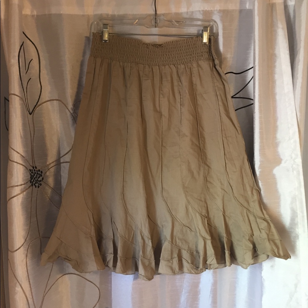 Tan and navy blue ruffle skirts